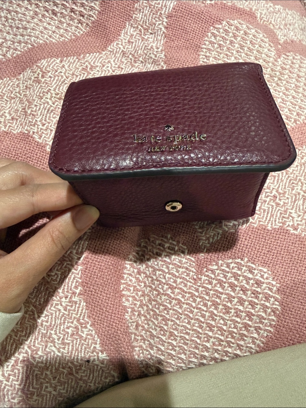 kate spade Pebbled Leather Compact Wallet in Berry Plum